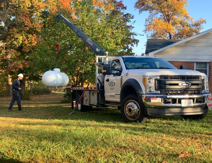 truck unloading a propane tank